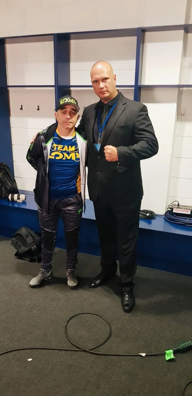 Event security officer with a guest in a backstage room