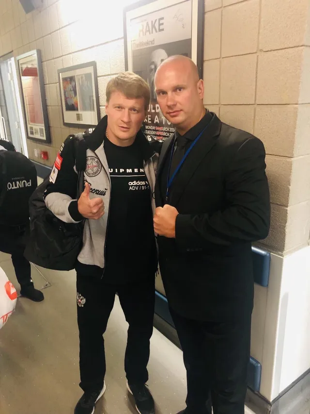 Event security officer with a boxer backstage at a sports venue