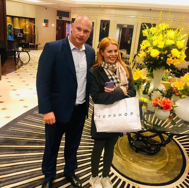 Security professional with a guest in a hotel lobby