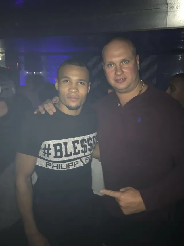 Security professional with an event guest inside a nightclub